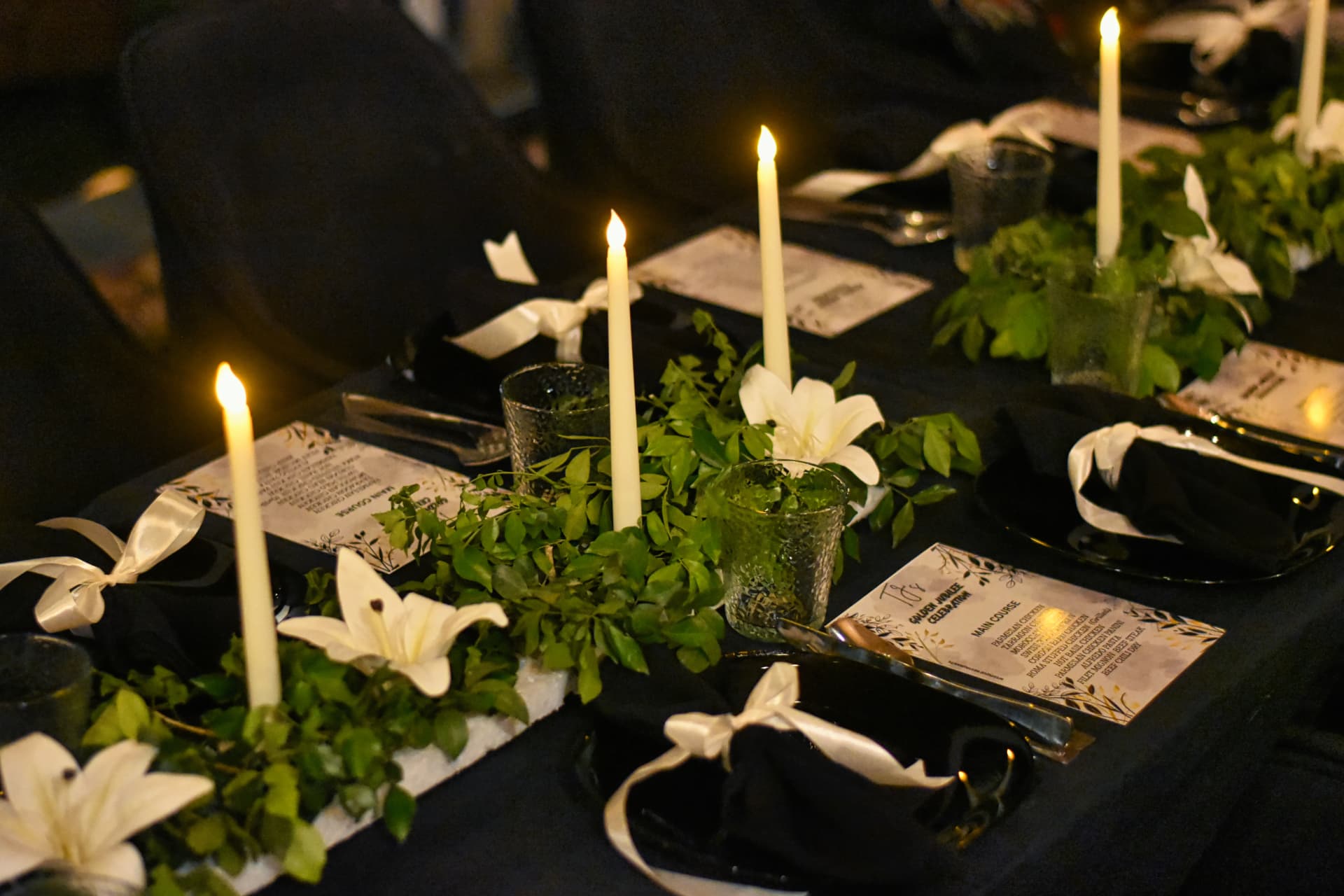 Floral arrangements and candles on the Lounge One table