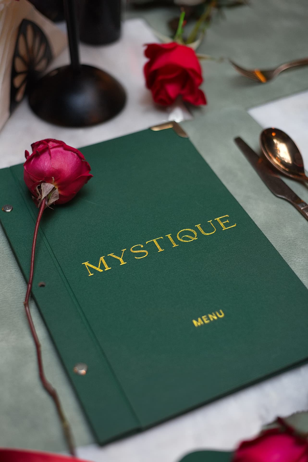 The Mystique menu, set with fresh roses