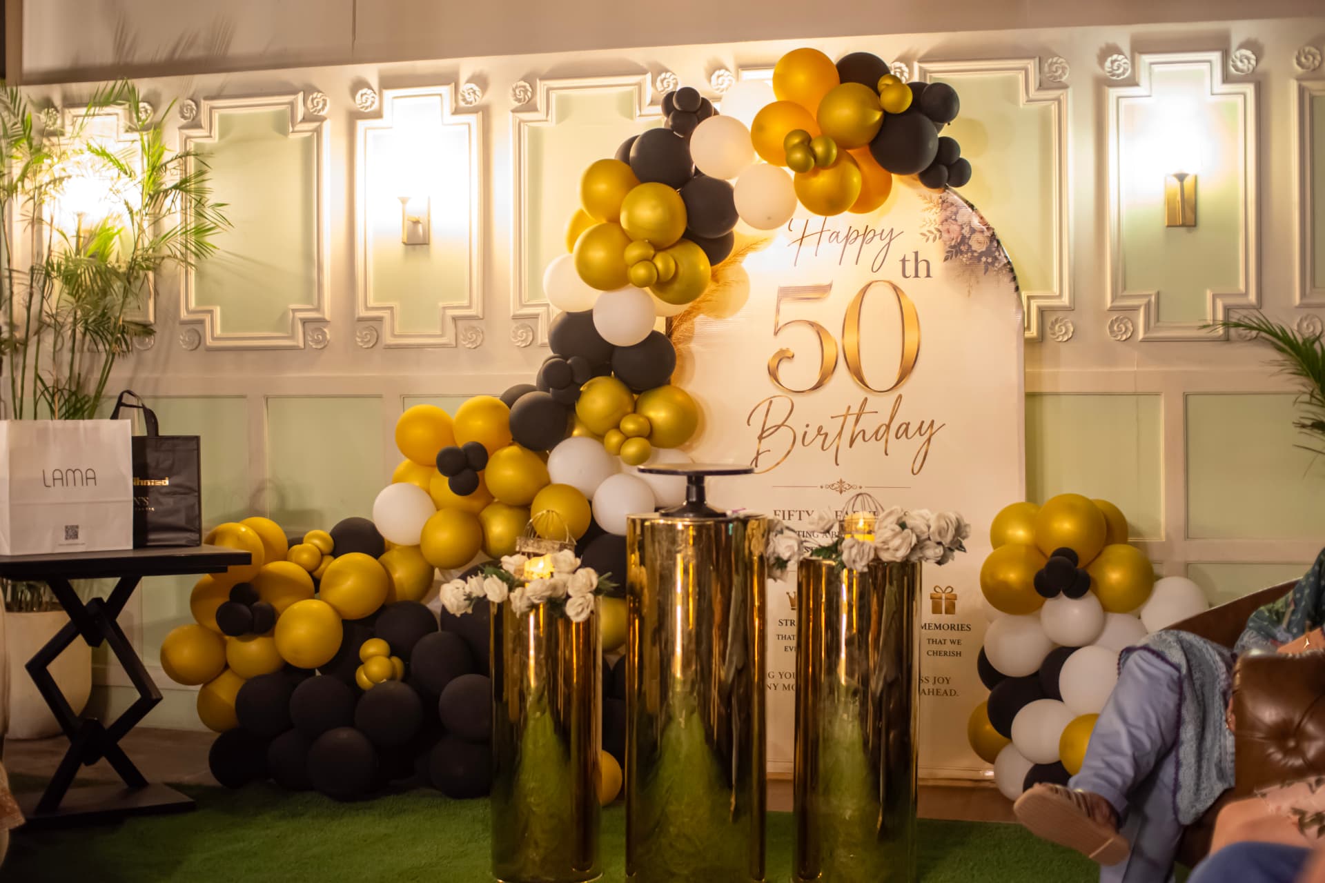 Gold and black birthday decorations in Lounge One