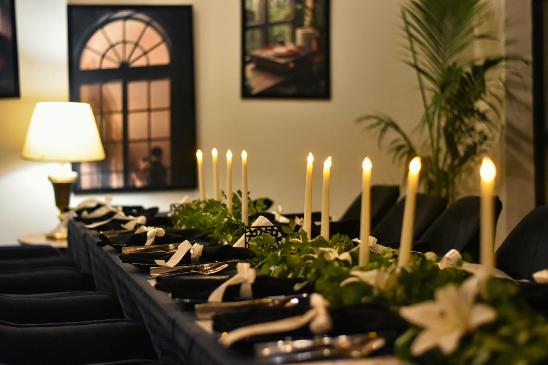 Candlelit long table prepared for a private gathering in Lounge One