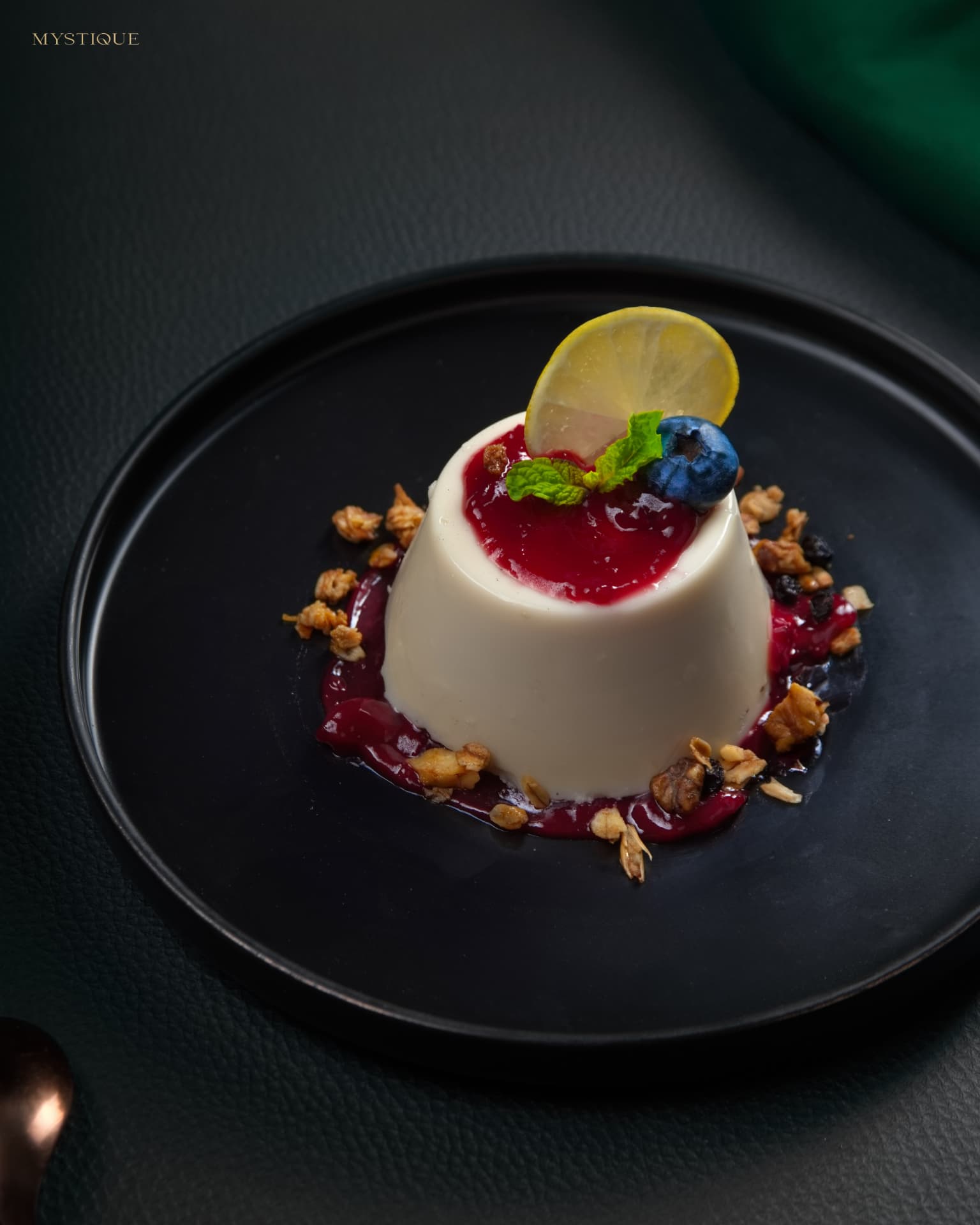 Vanilla panna cotta with berry compote and lemon