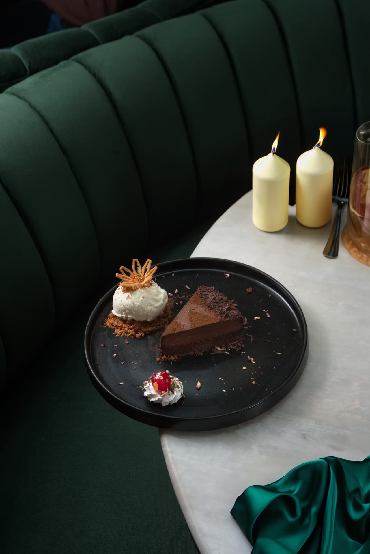 Chocolate tart served by candlelight